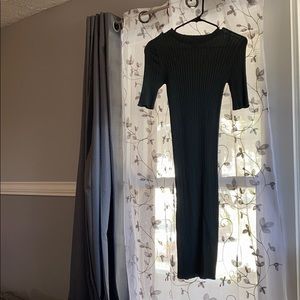 Dark green fitted stretchy dress when wearing it